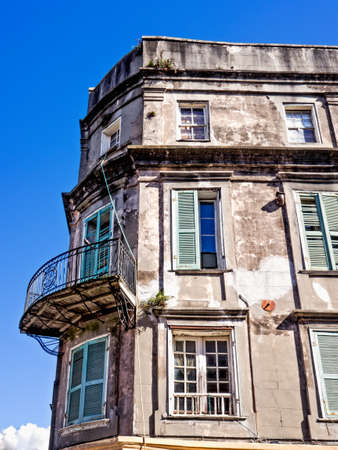 New Orleans LA USA -  Sep. 13, 2016  - Old building with balcony in the French Quarter of New Orleans with plants growing out of it.のeditorial素材
