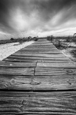 Point Clear AL USA - May 2, 2014  -  Wooden walkway across the sand in Black and Whiteのeditorial素材