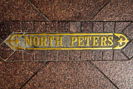 New Orleans, LA, USA -  Sep. 12, 2016  -  Street Sign In Pavement labeled North Peters.  You can only see this when you are walking.のeditorial素材