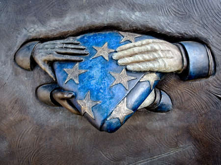 The Woodlands TX USA - Jan. 25, 2018  - Military Monument Hands on Flag in The Woodlands TX USAのeditorial素材