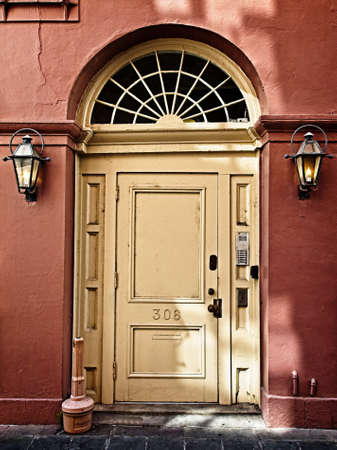 New Orleans, LA USA - May 9, 2018  -  Red Wall Yellow Door Fench Quarter