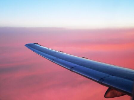 Airplane Wing and Pink Sunsetの写真素材
