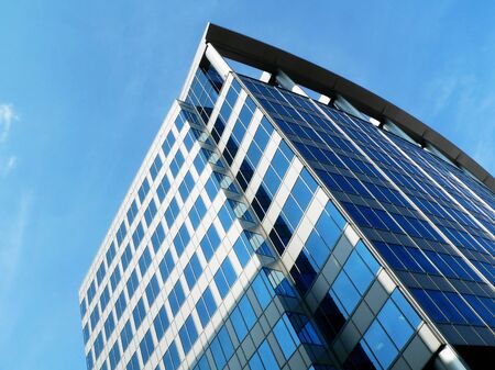 modern office building, jutting upward into the sky