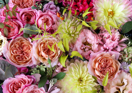 Flower arrangement of English roses, lisianthus, and dahlias.の写真素材