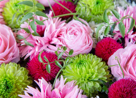 Flower Arrangement with Pink Ranunculus, Gerbera, and Green Mumsの写真素材
