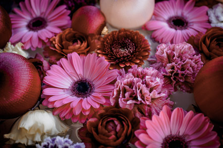 Pink flowers and ball ornaments floating on waterの写真素材