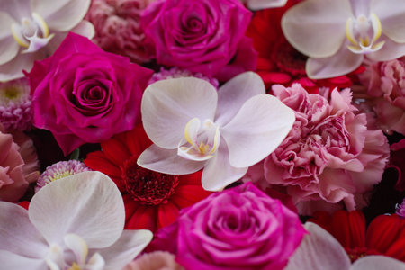 Flower arrangement with pink, red and white flowers.の写真素材