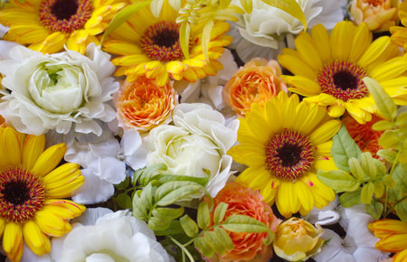 Flower arrangement with yellow and white flowers. Flat lay