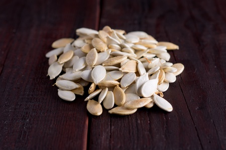 pumpkin seeds scattered on the old planks