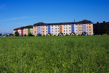 new apartment blocks surrounded by green fields, in the background the old blocksのeditorial素材