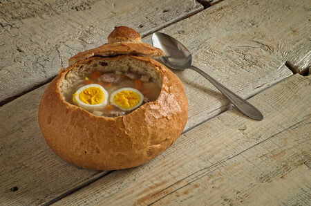 Easter soup with egg and sausage in bread