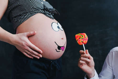 Funny pregnant woman bellyの写真素材