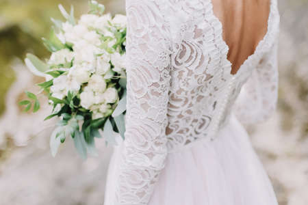 Bride holds a wedding bouquet, wedding dress, wedding details. Wedding photoの写真素材