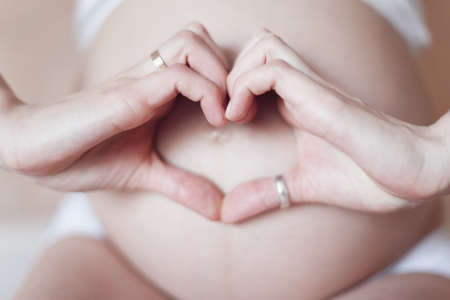 Pregnant woman touching belly. A woman waiting for baby.の写真素材