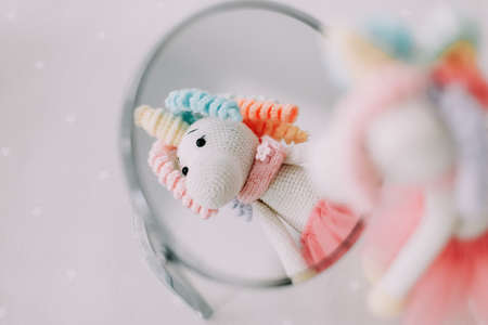 Funny toy unicorn. Knitted handmade toy. Children toysの写真素材