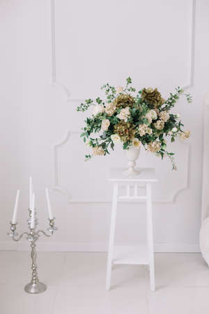 Bouquet of roses in a white interior. White background.  Interior design. Wedding detailsの写真素材
