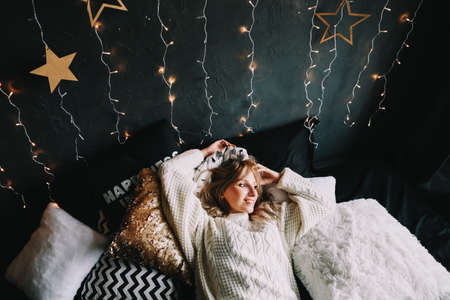 New Year's portrait of a girl in beautiful interiorの写真素材