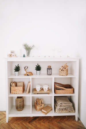 Cozy children room. A shelf with toys. New Year festive interior. Christmas decorations. Holiday concept. Scandinavian styleの写真素材