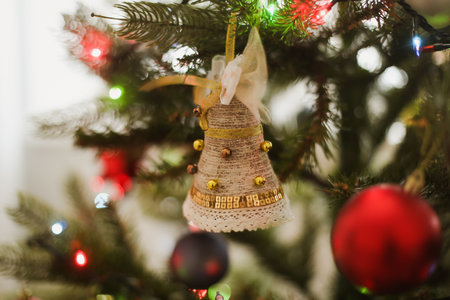 Christmas ball on a Christmas tree with a garland on the background. New Year backgroundの写真素材