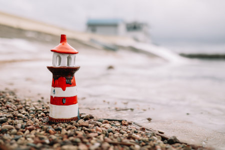 Frozen winter sea with decorative lighthouse. Nautical lifestyle. Winter, Sea, Travel, adventure, holidays and vacation concept. Travel in 2021の写真素材