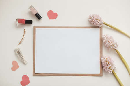 mockup with pink flowers and blank paper with copy space.の写真素材