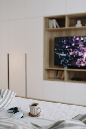 Game controller, joystick on TV screen background. Playing game console, weekend at home, leisure...