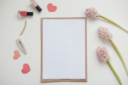 mockup with pink flowers and blank paper with copy space.の写真素材