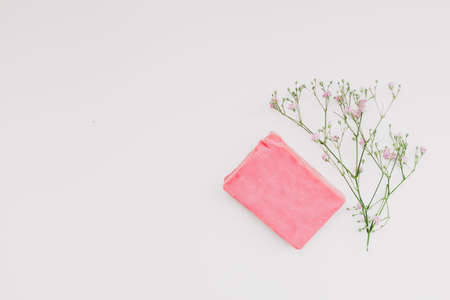 Natural handmade soap bar and flowers, spa organic soap on white backgroundの写真素材