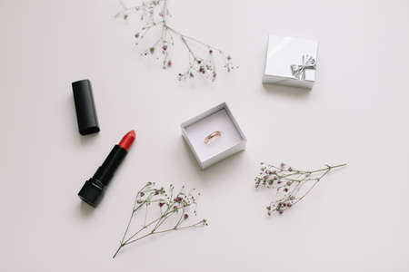 Golden ring and jewelry box and flowers. Wedding, Love, Valentines day, Happy Birthday, Proposal of marriage conceptの写真素材