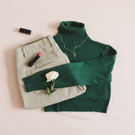Overhead view of women casual day outfit, stylish clothes and accessories on beige background. Flat lay, top viewの写真素材