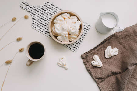 breakfast with a cup of coffee on a white table top view, flat layの写真素材