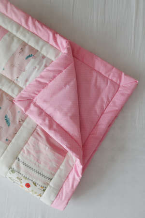 Pink patchwork blanket. Baby bedding. Bedding and textile for nursery. Nap and sleep time