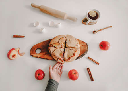 composition with a fresh baked apple pie with ingredients