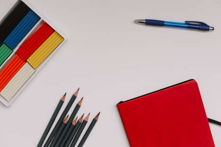 Back to school concept, school and office supplies, top view of notebook and pencils on white backgroundの写真素材