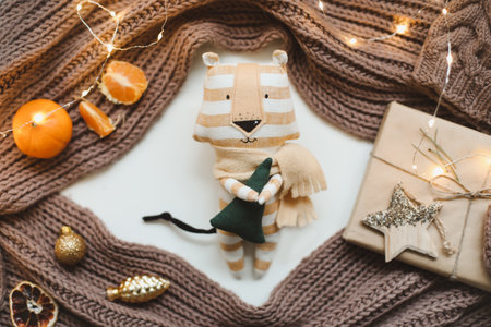 Christmas composition with a tiger toy, symbol of new 2022, a gift, fir tree branches and decorations. Christmas, winter, new year concept. Flat lay, top viewの写真素材
