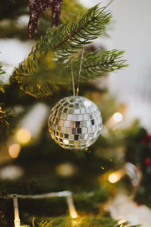 New Year mood 2022. Sparkling Christmas tree with balls and decorationsの写真素材