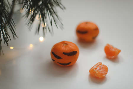 Christmas background with fir tree branches and tangerines. Merry Christmas and Happy New Year...