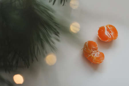 Christmas background with fir tree branches and tangerines. Merry Christmas and Happy New Year...
