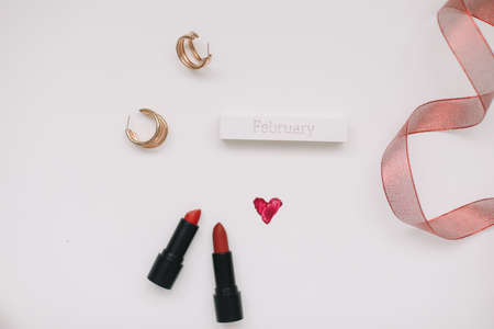 Concept Womens Day, Valentines Day, March 8. Lipsticks, cosmetic makeup products and accessories flatlay top view.の写真素材
