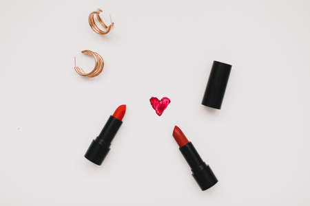 Concept Womens Day, Valentines Day, March 8. Lipsticks, cosmetic makeup products and accessories flatlay top view.の写真素材
