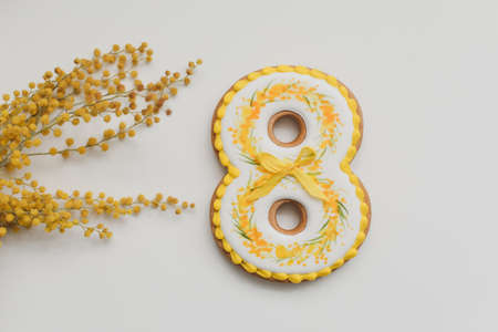 Womens Day, March 8, figure eight, gingerbread, flowers. Space for text.