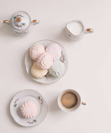 Good morning banner. Cup of coffee and homemade dessert zephyr. Top view. Food Photography with copy space. A cup of coffee and an airy marshmallow. Culinary background.の写真素材