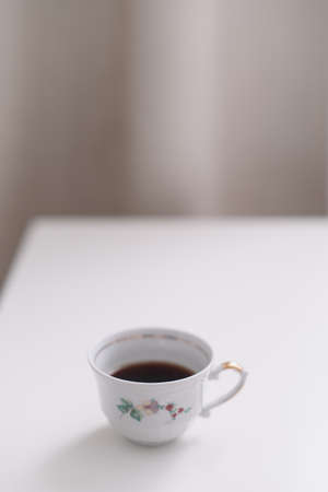 Good morning banner. Cup of coffee on a table. Minimal concept. Food Photography with copy space.の写真素材
