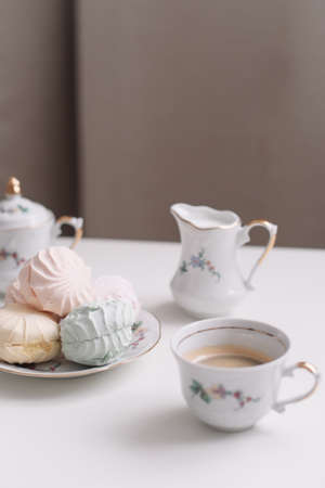 Good morning banner. Cup of coffee and homemade dessert zephyr. Top view. Food Photography with copy space. A cup of coffee and an airy marshmallow. Culinary background.の写真素材
