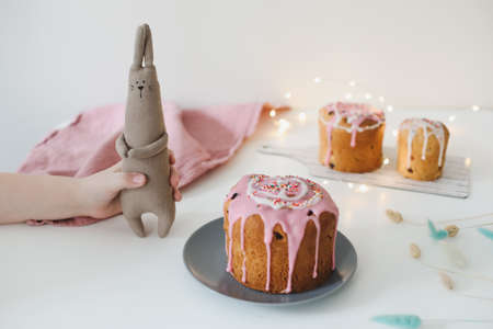 Easter cake, colorful eggs and rabbit toy. Happy Easter holiday concept. festive spring season.の写真素材