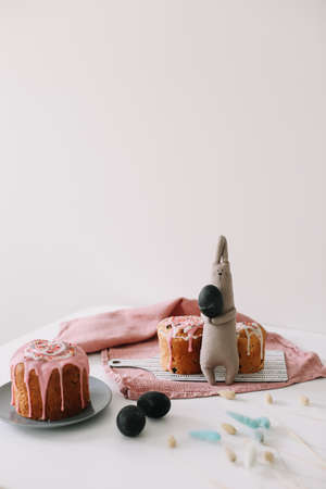 Easter cake, colorful eggs and rabbit toy. Happy Easter holiday concept. festive spring season.の写真素材