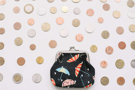 Open wallet with different coins isolated on white background top viewの写真素材
