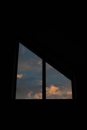 The view from the window of the dramatic sunset sky with clouds.の写真素材