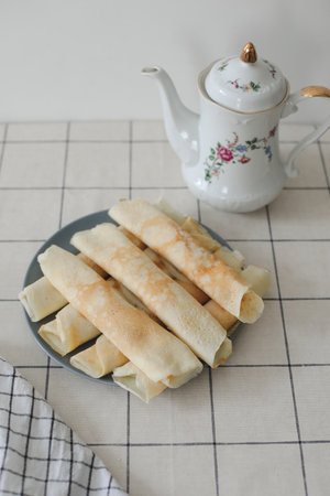 Stack of crepes on kitchen table. Pancakes for breakfast, food photographyの写真素材