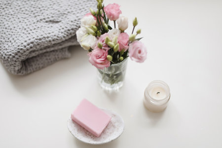top view of natural decorated homemade soap with flowers on white surface. spa organic soap. Natural vegan soap with rose fragranceの写真素材